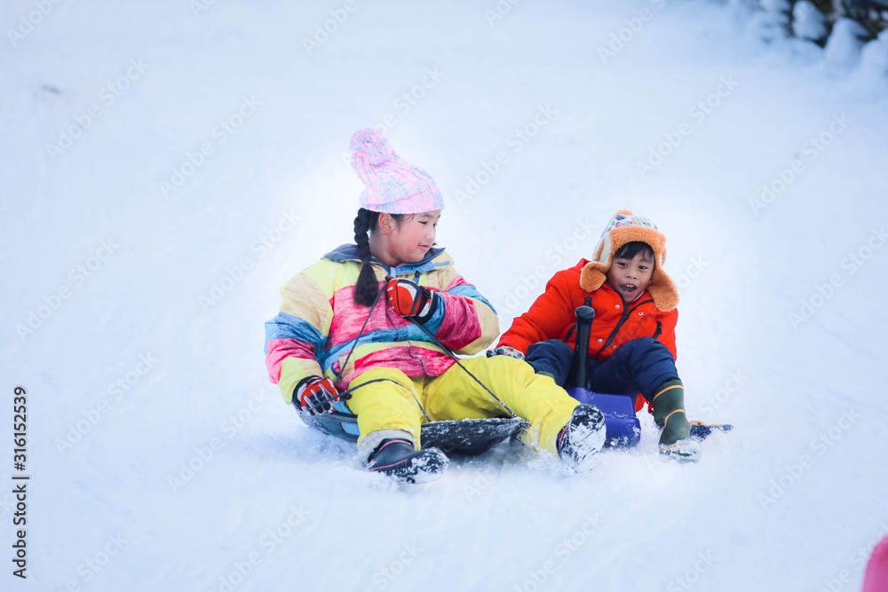 Asian girls playing snow happily in japan. , Children playing in the snow , Children playing in the snow happily.Asian boy playing snow happily in japan. Asian girls playing snow happily in japan. , Children playing in the snow , Children playing in the snow happily.Asian boy playing snow happily in japan.