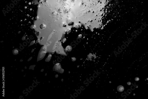 Soap foam, lather with bubbles isolated on black, with clipping path, texture and background, top view