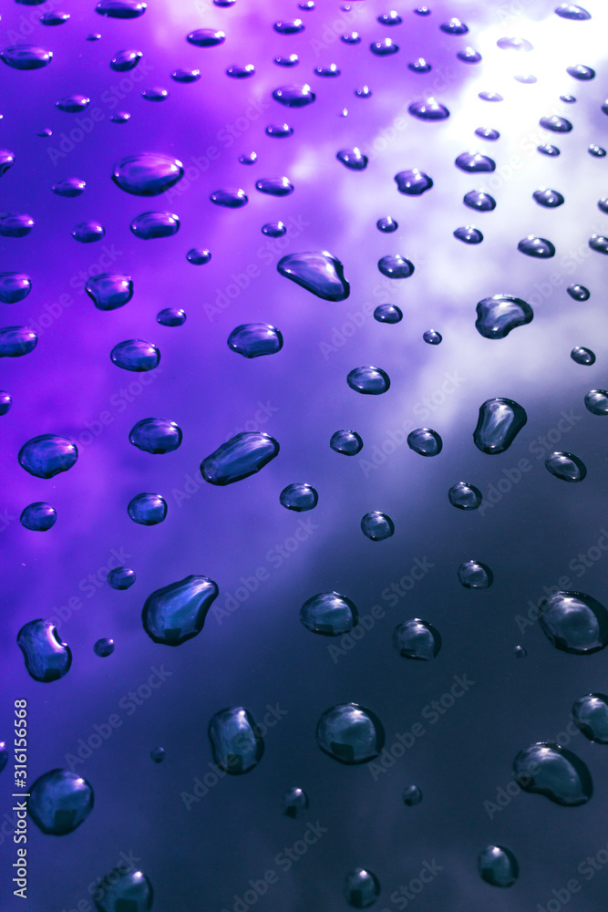Pattern of water drops in realistic style on neon background. Abstract backdrop. Blue metal surface. Water texture. Pattern of water drops in realistic style on neon background. Abstract backdrop. Blue metal surface. Water texture.