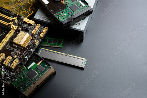group of old and used computer component part on dark background.  recycle and electronic waste concept.