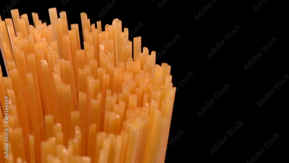 Spaghetti rotating on black background Spaghetti rotating on black background