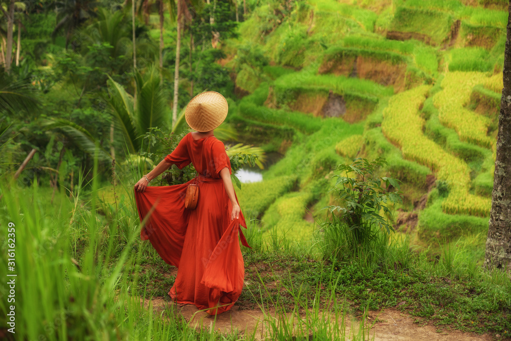 Woman walking on Tegalalang Rice Terrace, Bali