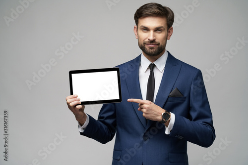 Young Businessman presenting digital tablet pc pad with blank screen