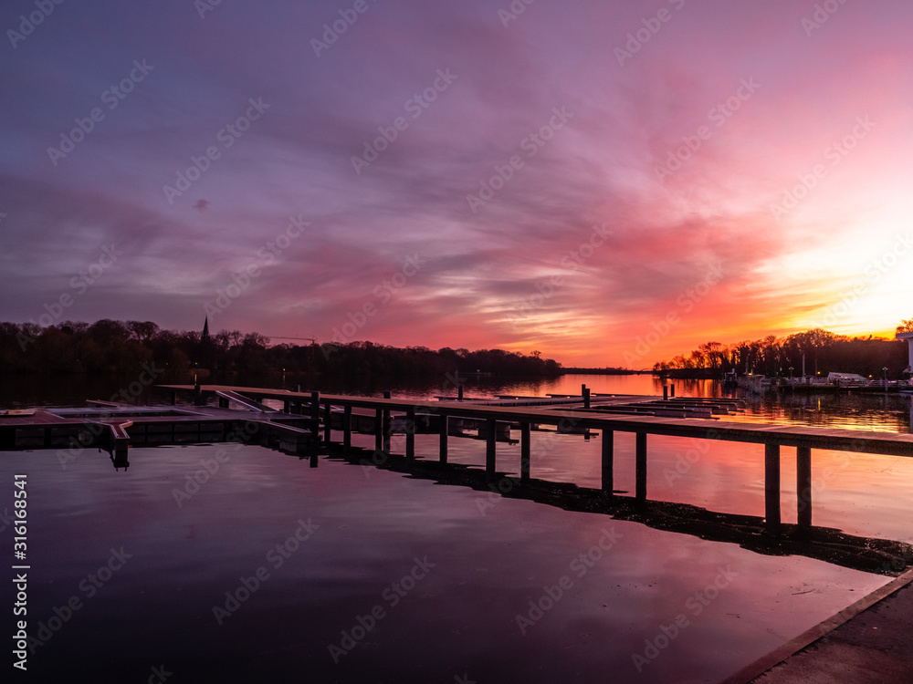 Reflection on a lake during colorful sunset, stock image, Potsdam, Germany