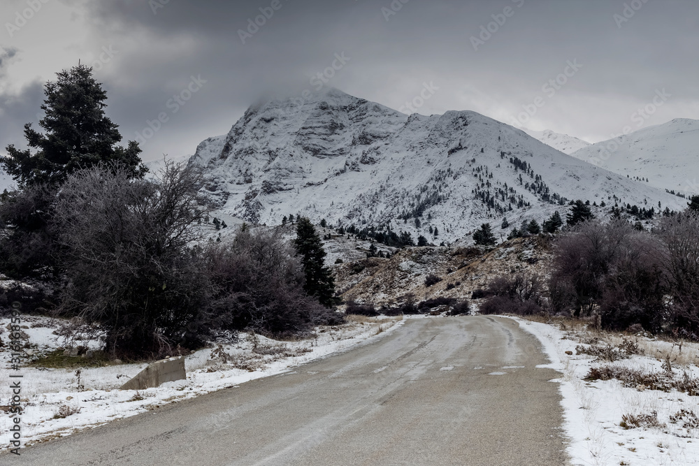 Country road in the highlands (Greece, Peloponnese) on a winter, snowy day
