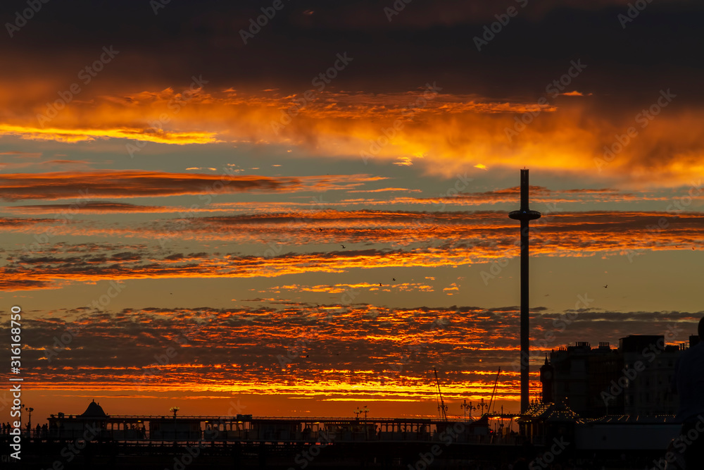 vivid sunset and strange cloud formation on Brighton beach
