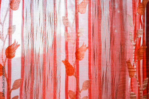 Tende di tessuto arancioni con tema fiori, texture