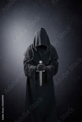 Obraz na płótnie Ghostly figure with medieval dagger in the dark