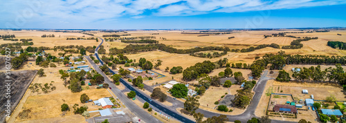 Wide aerial panoramic landscape of rural road passing through small township of Streatham in Victoria, Australia photo