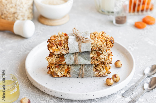 Homemade granola bars with pumpkin seeds and dried apricots.