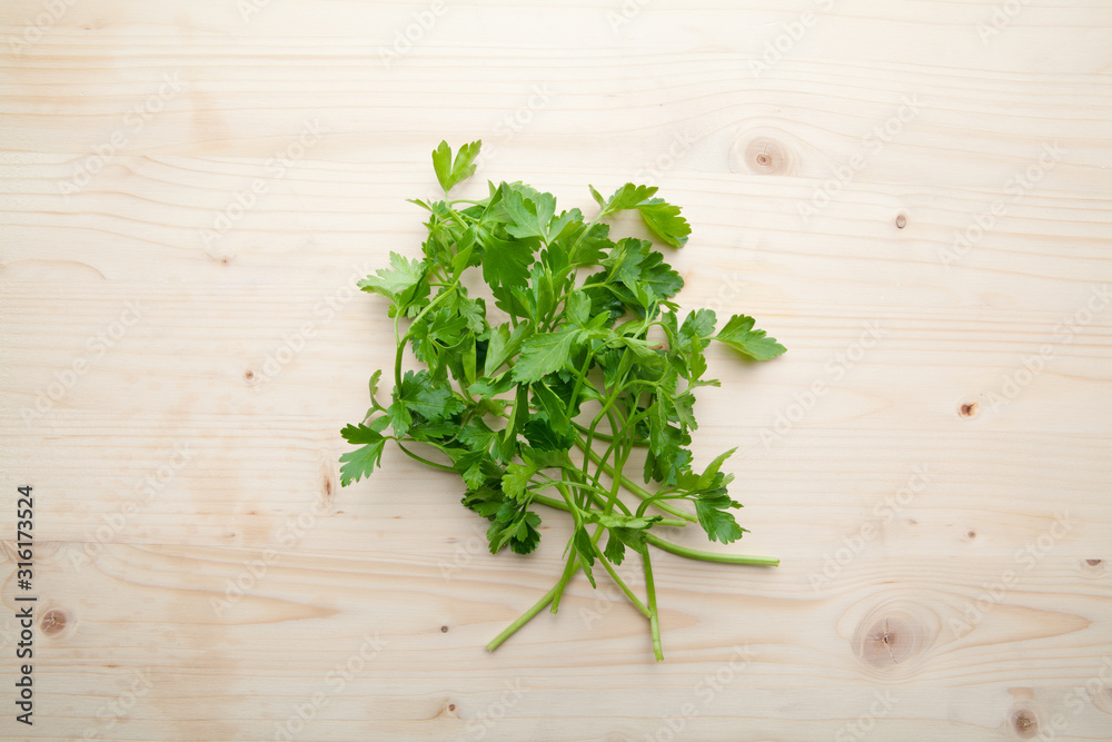 Green Parsleys on a wooden background. Green Parsleys on a wooden background.