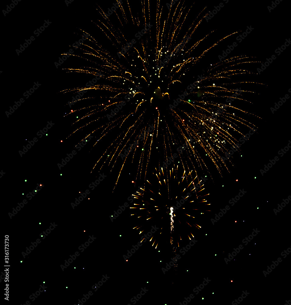Fireworks sparkles in the night sky as background Fireworks sparkles in the night sky as background