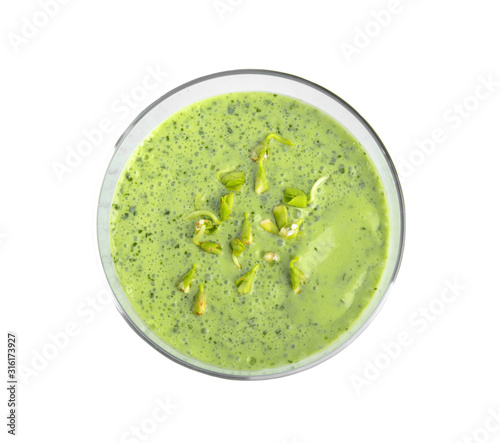 Glass of green buckwheat smoothie isolated on white, top view