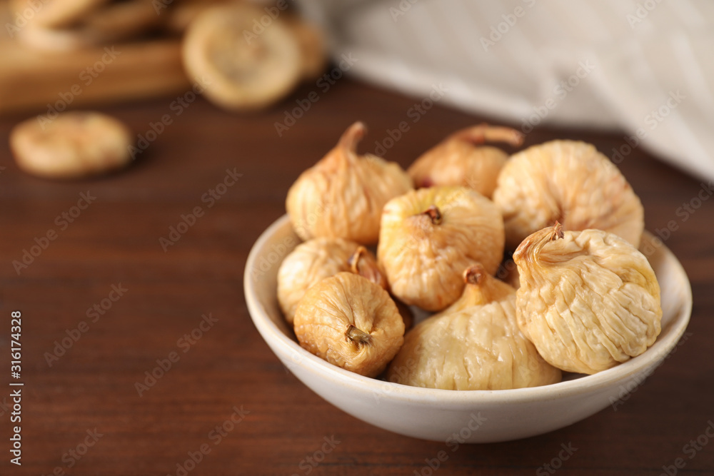 Tasty dried figs on wooden table, closeup. Space for text Tasty dried figs on wooden table, closeup. Space for text