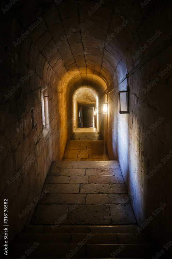 Narrow corridor in the Jerónimos Monastery or Hieronymites Monastery of Belém, in Lisbon, Portugal