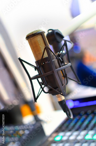 closeup on a retro styled broadcasting microphone for voice over recording or radio station show and speech communication