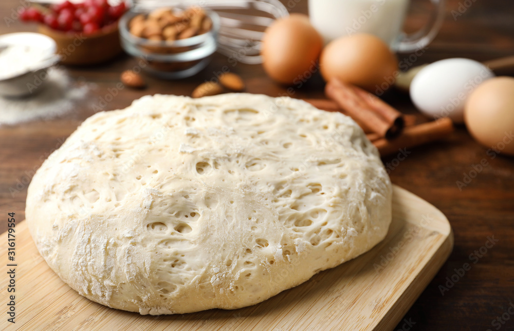 Board with wheat dough for pastries, closeup Board with wheat dough for pastries, closeup