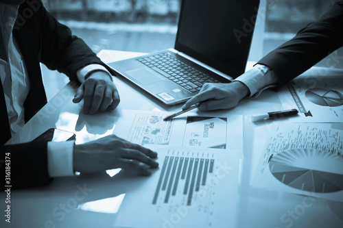 Business team discuss and brainstorm for financial project in the meeting room of the company.