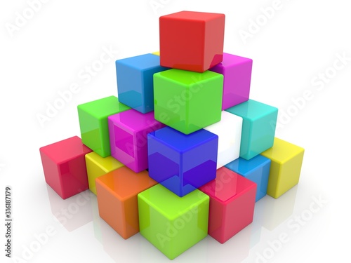 Different color toy blocks stacked on top of each other on white