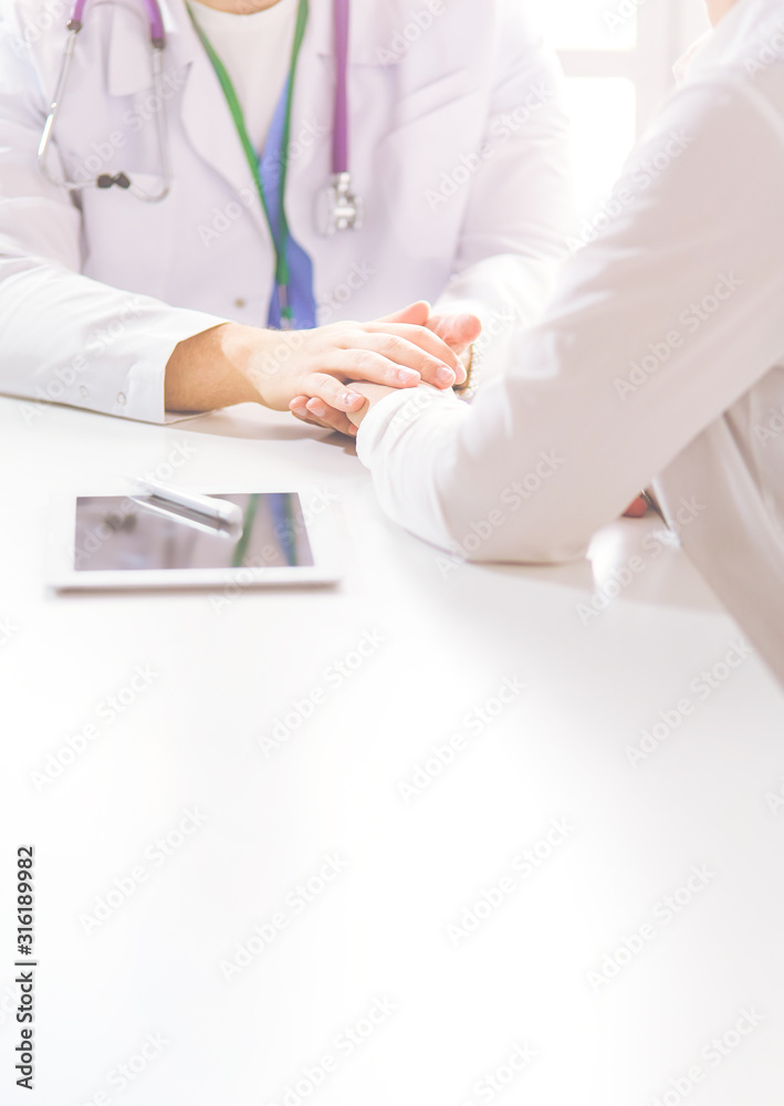 close up of patient and doctor prescribing medication close up of patient and doctor prescribing medication