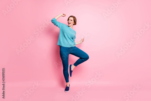 Fototapeta Naklejka Na Ścianę i Meble -  Full length body size view of her she nice attractive lovely funky cheerful cheery brown-haired woman having fun dancing carefree lifestyle isolated over pink pastel color background