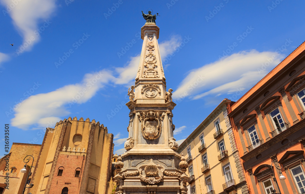 The Piazza del Gesù Nuovo, located on the lower decumano, is the symbolic square of the historic center of Naples. It is dominated by the imposing marble obelisk of the Immaculate. 