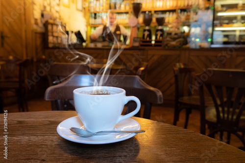 closeup of a cup of coffee at coffee shop