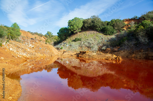 Red lake 'Le Conche' on Elba island. Tuscany, Italy photo