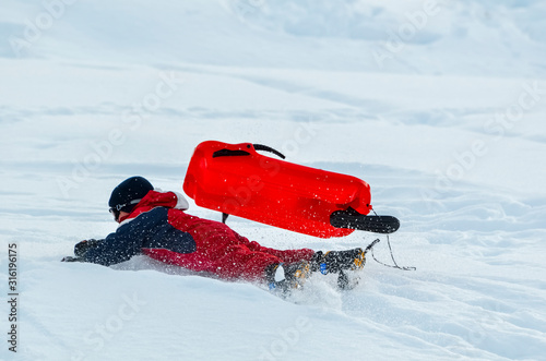 Obraz na płótnie active boy falling from a sled w salonie