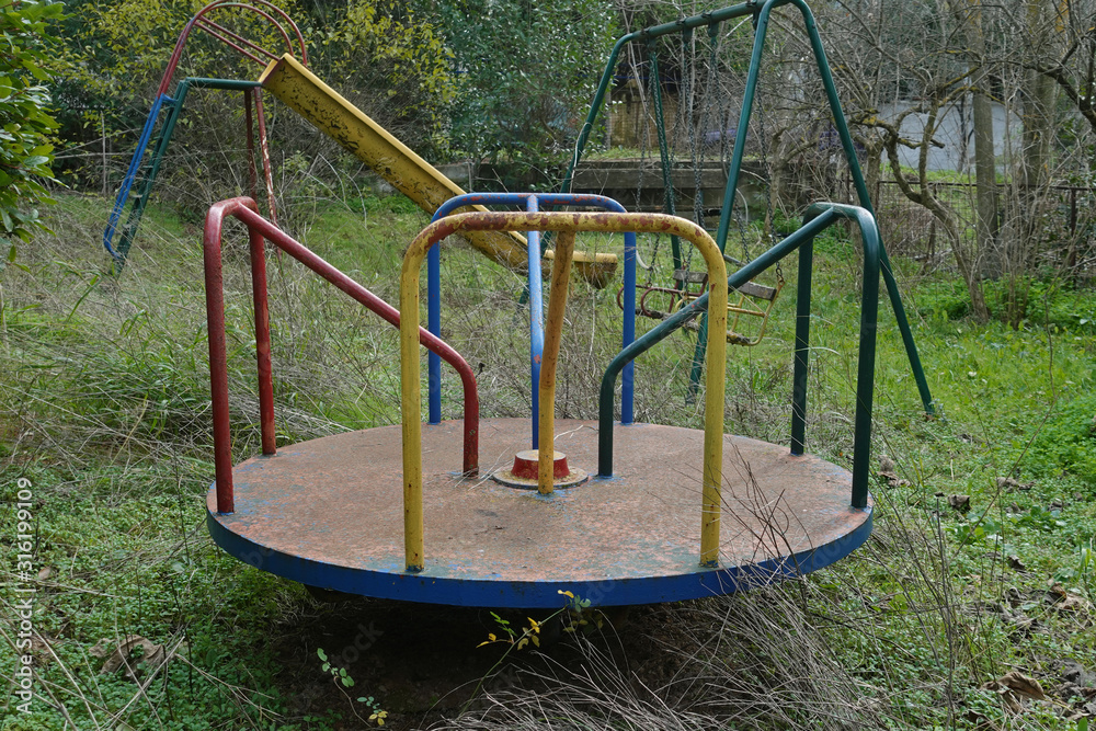 playground in overgrown garden playground in overgrown garden