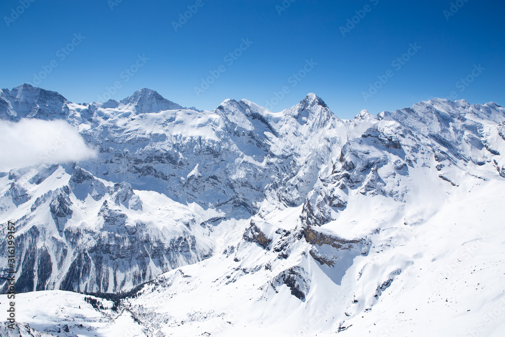 Winter landscape, Mountains covered by snow with clear blue sky without clouds in sunnyday winter in Switzerland