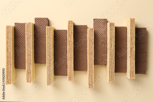 Flat lay with wafers on beige background  top view