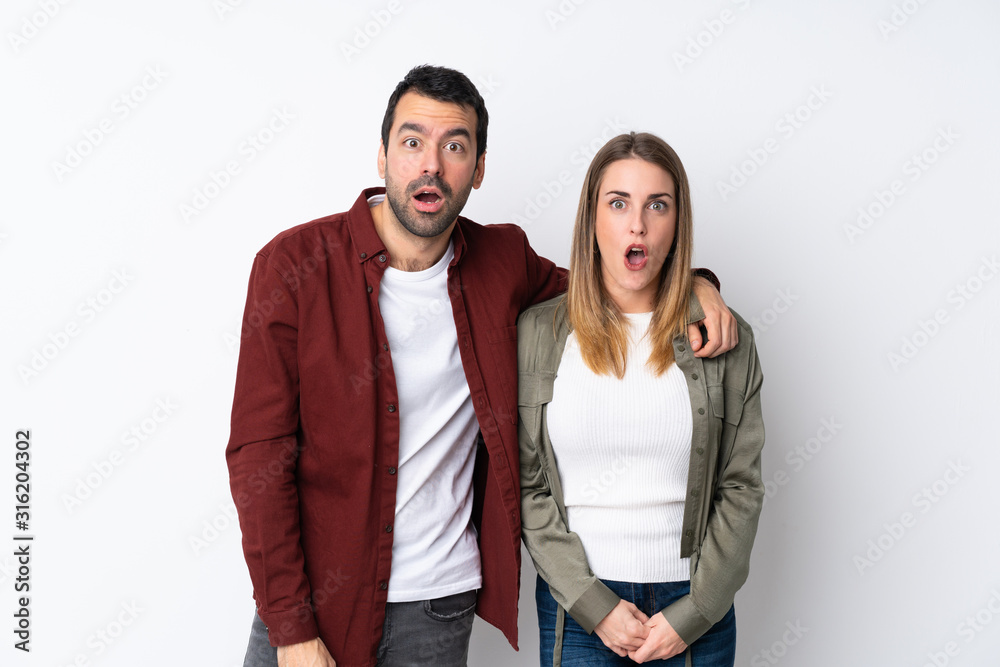 Couple in Valentine Day over isolated background with surprise facial expression Couple in Valentine Day over isolated background with surprise facial expression