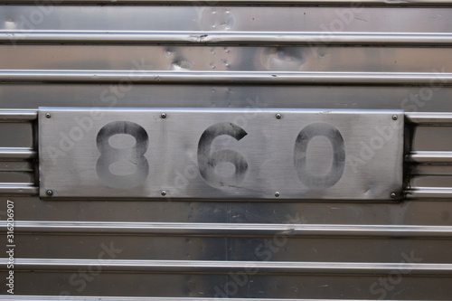 numbers 8 6 0 in black on silver background