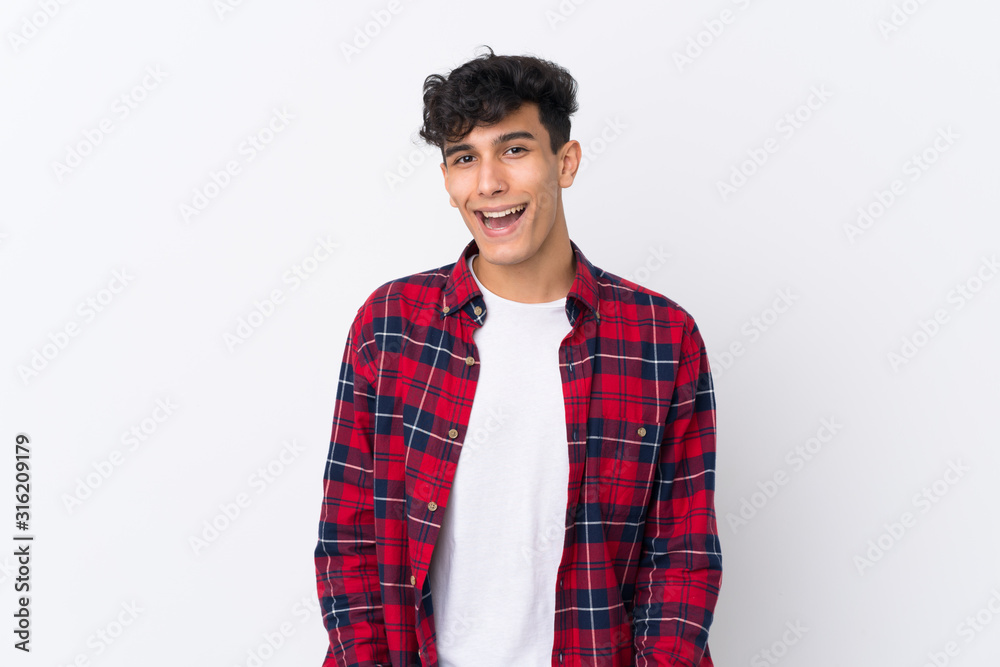 Young Argentinian man over isolated white background with surprise facial expression Young Argentinian man over isolated white background with surprise facial expression