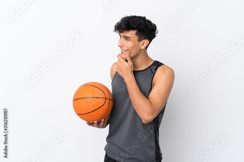 Basketball player man over isolated white background looking side