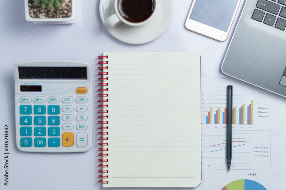 notebook and cup of coffee on table notebook and cup of coffee on table
