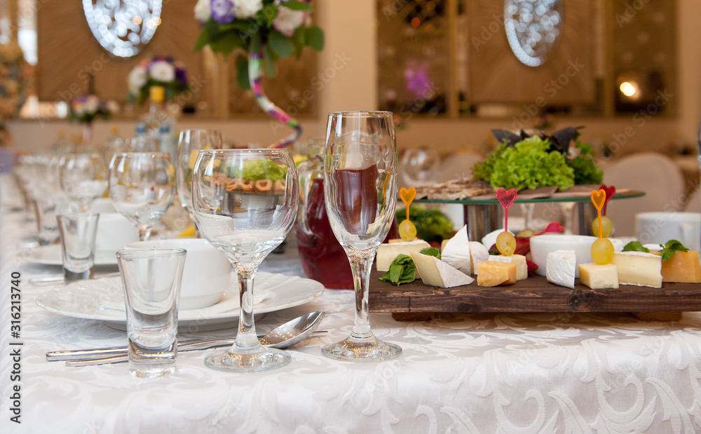 Served table in a restaurant. Glasses, wineglasses ...