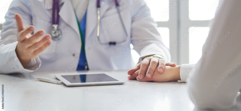 male doctor comforting patient who is in ambulance male doctor comforting patient who is in ambulance