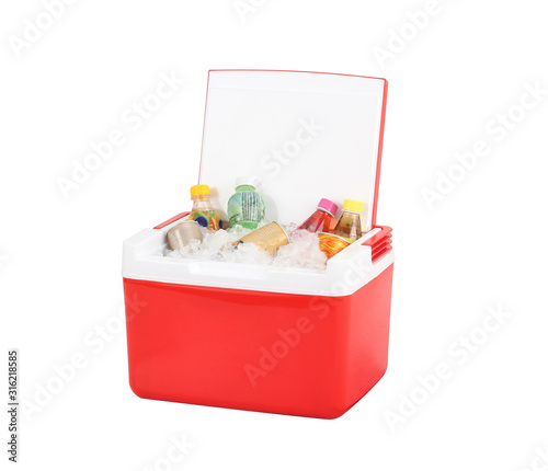 Opened red cooling box with bottles of beverage and ice photo