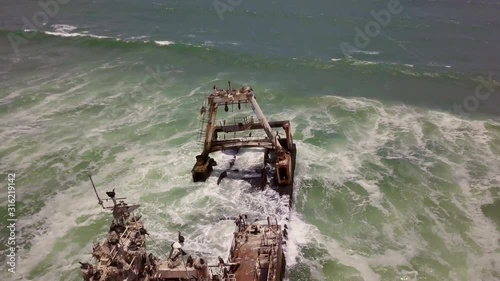 This shipwreck was filmed with a DJI Mavic Pro at 4K 29.97fps on the Skeleton Coast in Namibia. Skeleton Coast of African on the Atlantic Ocean. photo