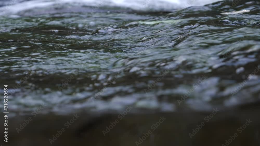 Natural river water running past, cool and refreshing