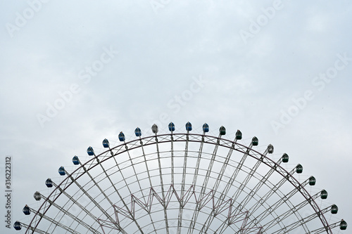Partial view of a ferris wheel in the harbor of Osaka-Japan.