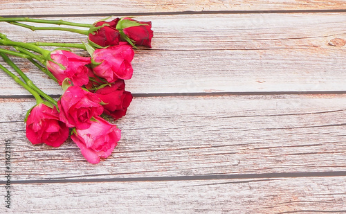 Roses and a  on wooden board  Valentines Day background  wedding day..