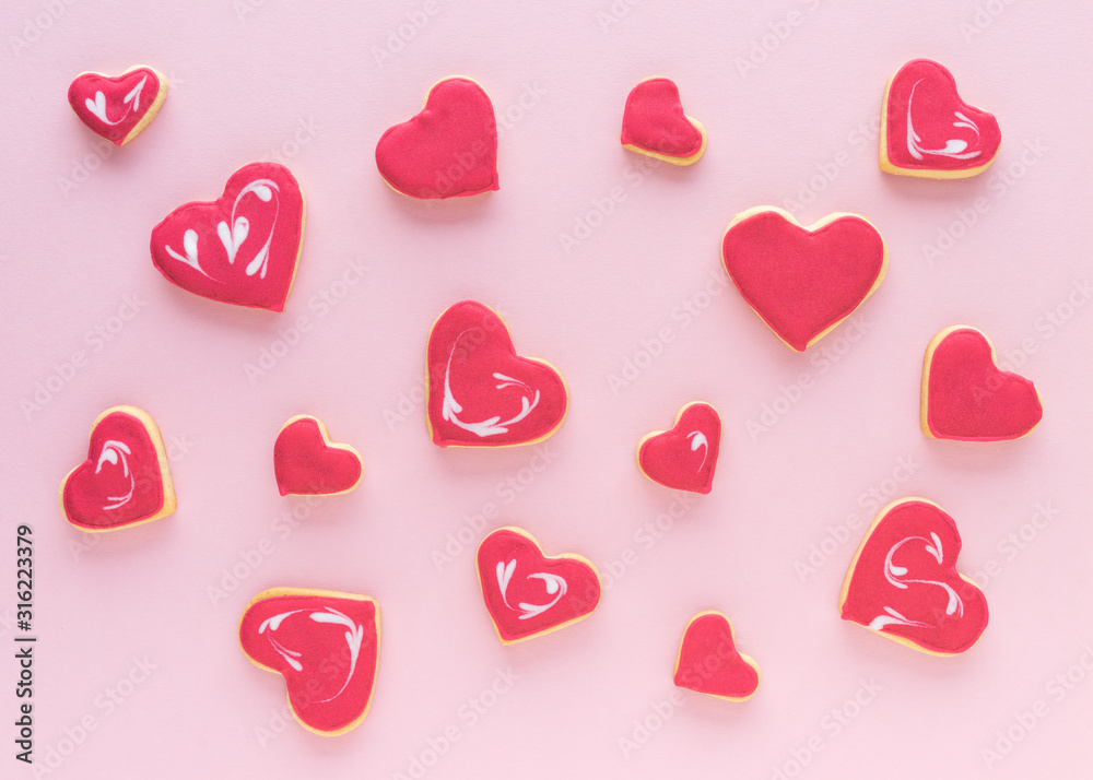 Heart shaped cookies on a pink background. Flat lay. Valentine's Day concept.