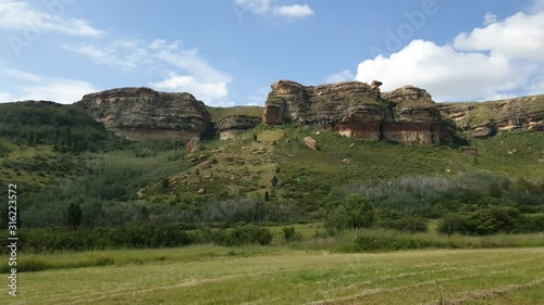 Scenic Camelroc guest farm Moluti sandstone mountain cliffs cloud time lapse in the late afternoon over the sandstone cliffs near the Lesotho border photo