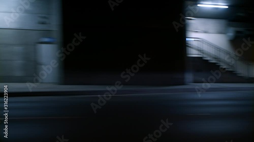 Driving through the tunnel, passing side view on walls, motion blur, high quality 4k prores photo