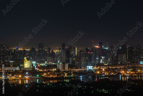 Beautiful view of Bangkok city, Beauty skyscrapers along Chaopraya river in the night, making the city modern style. © num
