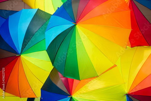 Rainbow umbrella background,Colorful umbrella background ,Many colorful rainbow umbrellas