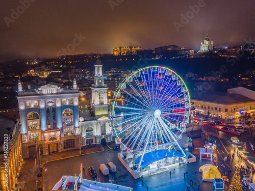 Aerial drone view. Ferris wheel in Kiev in the evening.